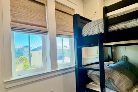 Full-over-full bunk beds with a twin trundle create the perfect sleep space for kids or groups.