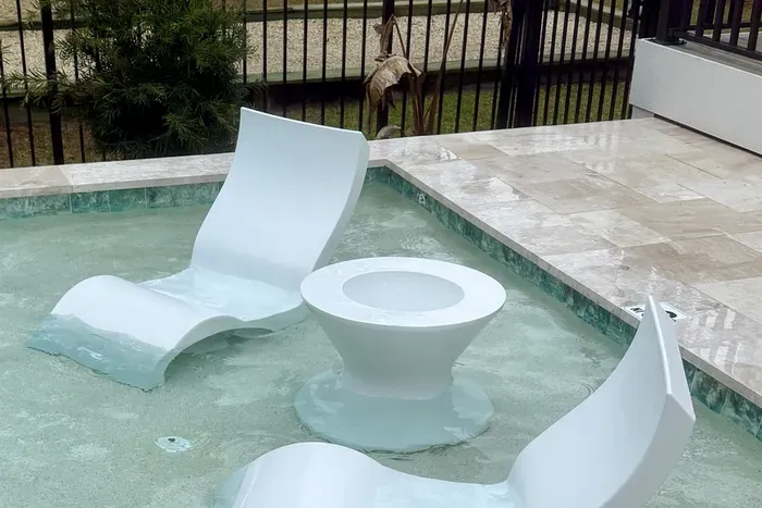 Ledge loungers with ice bin table — fill up the ice bin and enjoy cold drinks while you lounge the day away!