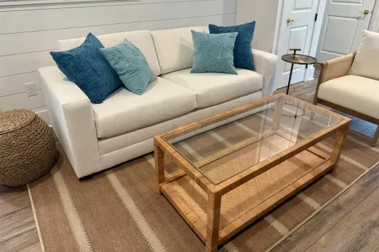 Living area seating with queen sofa bed, side chair, and cocktail table