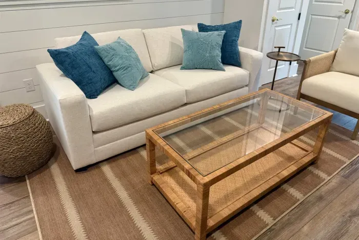 Living area seating with queen sofa bed, side chair, and cocktail table