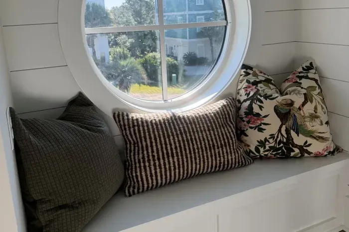 A cozy porthole perch—perfect for a quiet moment