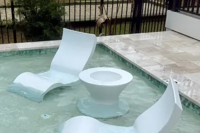Ledge loungers with ice bin table — fill up the ice bin from the wet bar ice machine and enjoy cold drinks while you lounge the day away!