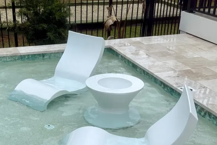 Ledge loungers with ice bin table — fill up the ice bin from the wet bar ice machine and enjoy cold drinks while you lounge the day away!