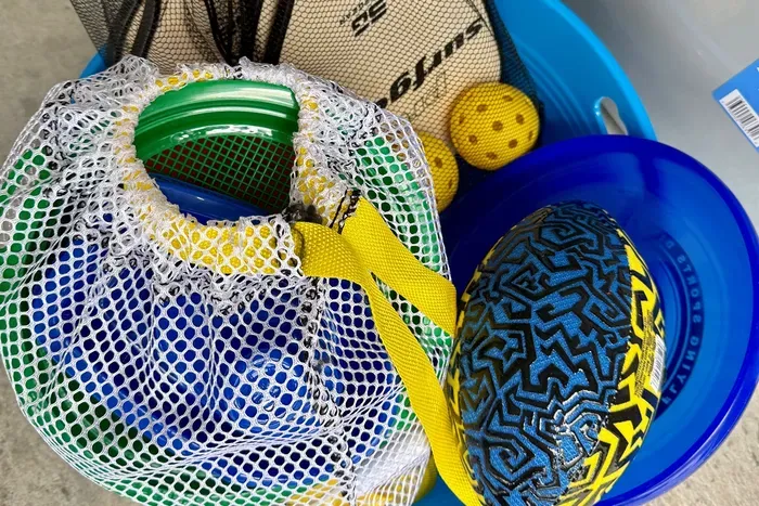 Enjoy 2 pickle ball sets for the nearby courts as well as a few beach toys.