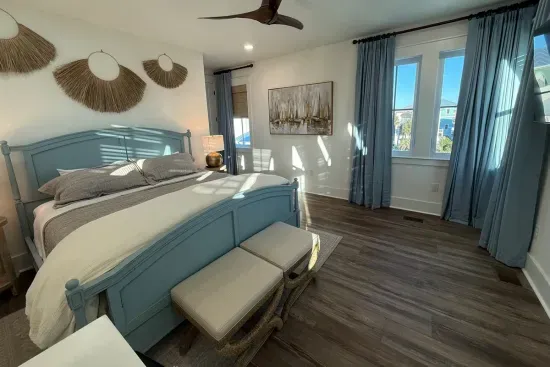 Stretch out at the foot of the bed and take in the light pouring through the paired windows — a quiet corner of the guest house all your own.