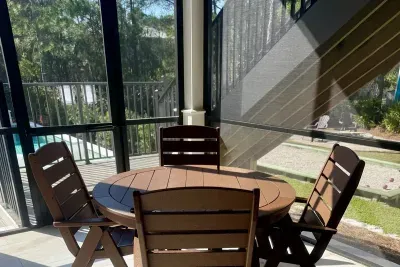 Grab a poolside snack at this screened table for four — extra seating that stretches your group's outdoor dining capacity.