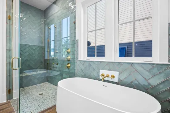 Let the natural light through the shutters set the mood while you shower off after a long pool day.