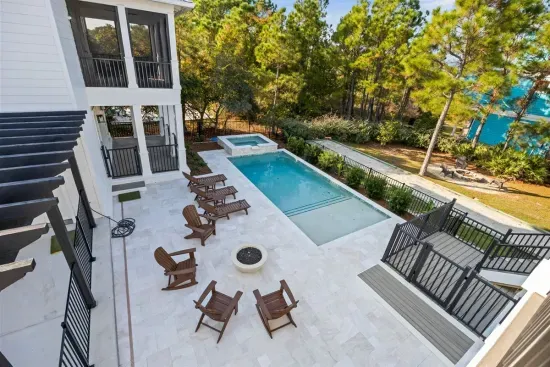 From the upper porch, you'll see it all at once — spa, fire bowl, and pool laid out below, ready whenever you are.