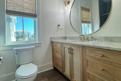 Catch the rooftop view reflected in the round mirror while you get ready for the beach.