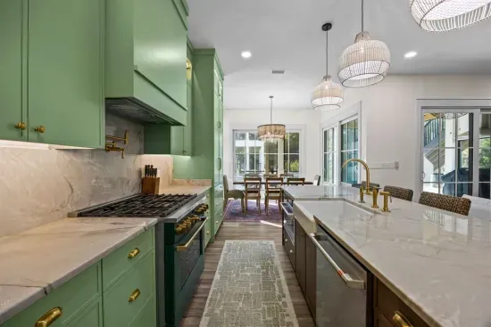 Cook side by side down the galley and watch the dining table fill up through the open sightline to the porch beyond.