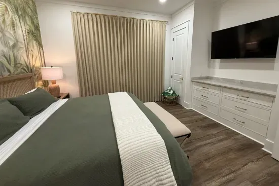 Watch a show from bed before lights-out — this king room comes with its own TV and plenty of built-in dresser space to unpack.