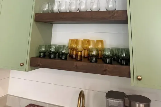 Mix a round of cocktails at the wet bar, or brew a cup of coffee instead — glassware, ice, and a driftwood pelican keeping watch over happy hour or coffee hour alike.
