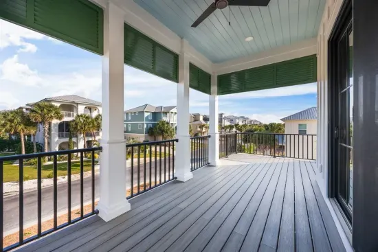 Settle into an Adirondack chair with your feet up under the haint-blue ceiling — a Southern porch tradition — rooftops and palms in view, coffee that tastes better up here.
