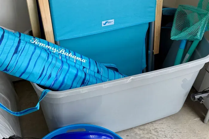 2 beach umbrellas as well as 10 back pack beach chairs provided for use (2 shown plus 8 Tommy Bahama chairs).  Wagon available, but skip the walk and take the neighborhood shuttle to beach walkover.