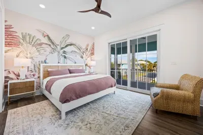 Settle into this cozy wicker nook and slide the door open to sky, palm treetops, and the far-off sounds of pool, tennis, and pickleball days at Osprey Circle.