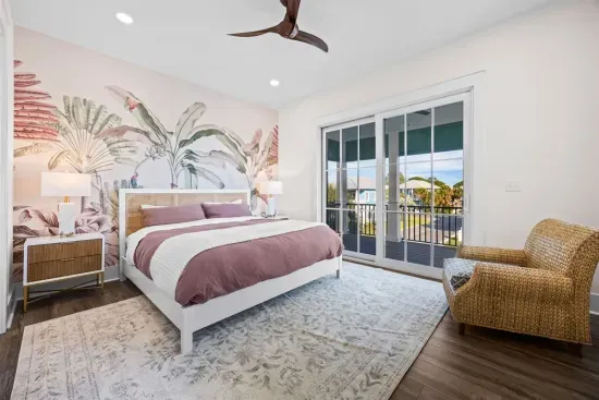 Settle into this cozy wicker nook and slide the door open to sky, palm treetops, and the far-off sounds of pool, tennis, and pickleball days at Osprey Circle.