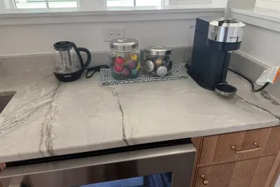 Make a quick Nespresso pod or steep a cup of tea right by the bedroom — mornings start here before anyone else is up.