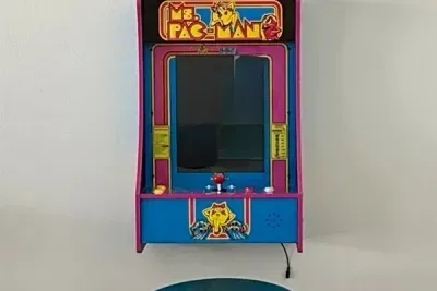 Enjoy a touch of 80s nostalgia with a Mini Ms. Pac-Man arcade game
