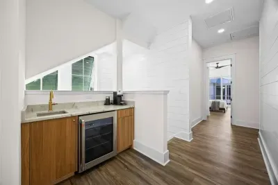 Grab your favorite chilled or hot drink from the upstairs beverage station without a trip downstairs — featuring a refrigerator, Nespresso Vertuo coffee machine, and tea kettle, it's just steps from all three upstairs bedrooms.