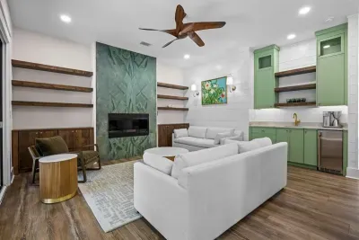 Mix a drink at the wet bar without leaving the fireplace conversation — everything you need for a night in is within reach.
