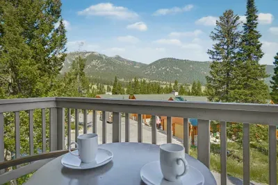 Private balcony with coffee setup and stunning mountain views