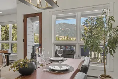 Bright dining area with mountain views and abundant natural light