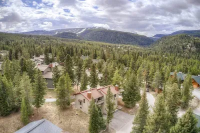 Drone view from back of condo tucked away in quiet Hidden Village, 2 minutes away from downtown Big Sky.