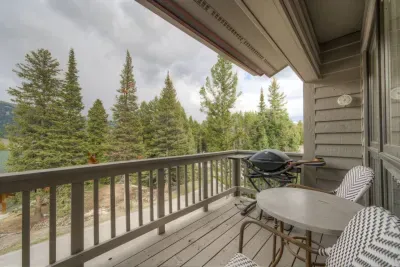 Cozy patio comes equipped with furniture and grill!