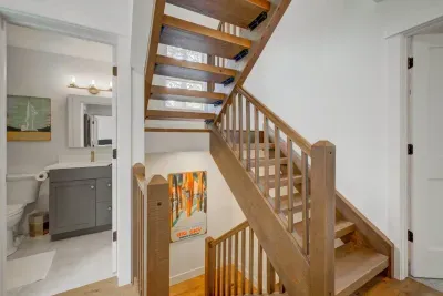 Detached secondary full-bath across from guest room, also easily shared with guests staying downstairs!