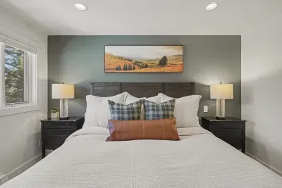 Cozy king bedroom with stylish decor and peaceful natural light