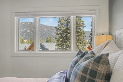 Cozy bedroom with mountain views and bright natural light