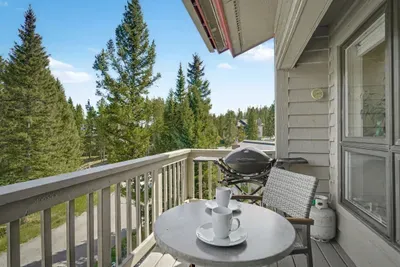 Private balcony with grill and peaceful forest views