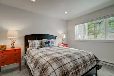 Guest bedroom with queen bed and private closet.