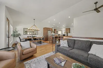 Spacious open-concept living with modern kitchen and stylish dining area