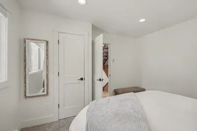 Bright, cozy bedroom with modern finishes and a clean, calming design