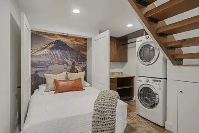Cozy mountain-inspired sleeping nook with in-unit washer/dryer