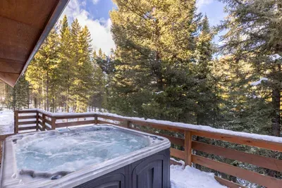 Enjoy the mountain views and a dip in the hot tub after a long day on the mountain