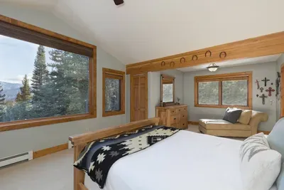 Spacious master bedroom with stunning mountain views