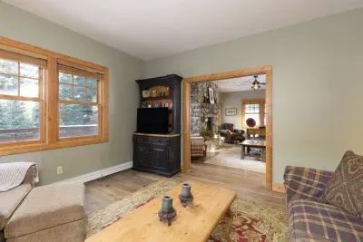 Den connected to living room for movie night after a long day on the slopes