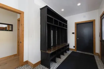 Mudroom has direct access to garage, remember no ski boots inside!
