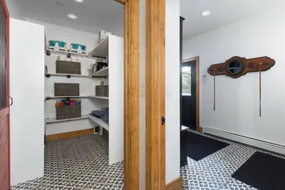 Walk in pantry stays stocked for all your needs, like towels for the hot tub and board games!