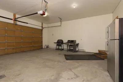 Comfortable two car garage and 2 grills!