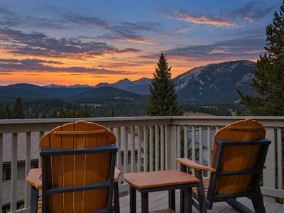 Private mountain-view deck with Adirondack seating and stunning sunset vistas