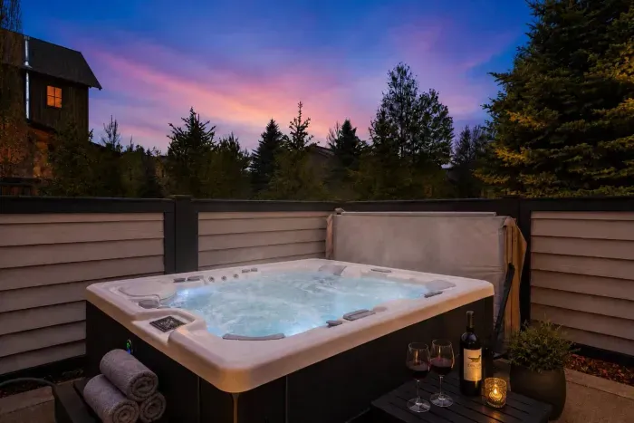 Private hot tub with privacy walls—ideal for après-ski or relaxing summer evenings.