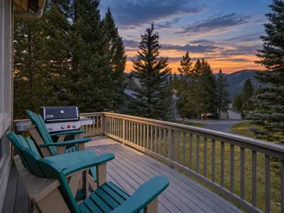 Scenic mountain-view deck with grill and sunset seating