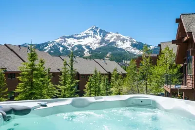 Hot Tub Oasis: Soak in the bubbling waters with breathtaking mountain views! Perfect for relaxation.