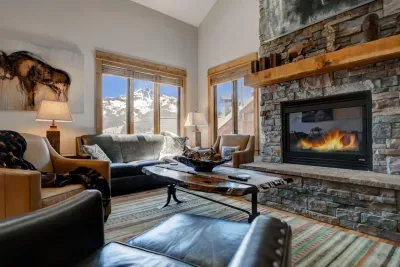 Living Room: Experience stunning mountain views by the fireplace with stylish, rustic decor!