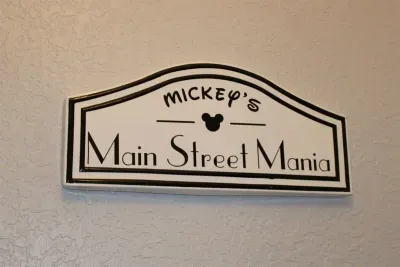 - Mickey’s Main Street Mania sign sets the tone for a fun filled Disney getaway  
- Adds a cheerful welcome for guests upon entering this themed retreat  
- Creates a sense of excitement for the magical stay ahead