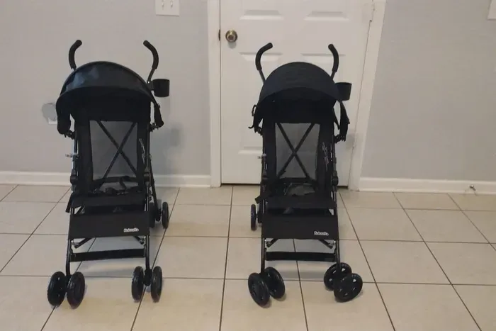 Two lightweight strollers ready for guest use.