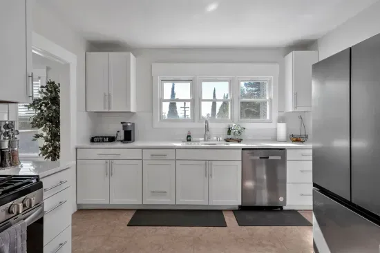 Modern conveniences! Gas stove, dishwasher, refrigerator. Kitchen has Keurig coffee maker, toaster, and blender.